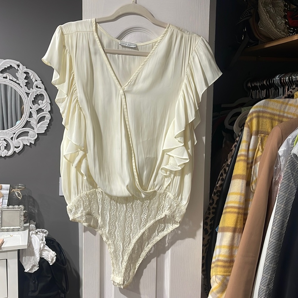 Off white/cream colored ruffle sleeve lace bodysuit